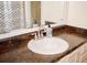 Bathroom sink with decorative soap dispenser and mirror at 2592 King Louis Ne Rd, Conyers, GA 30012
