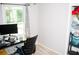 Bedroom with desk, chair, and closet filled with items at 2592 King Louis Ne Rd, Conyers, GA 30012