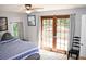 Bedroom with a bed, French doors and view of the outdoors at 2592 King Louis Ne Rd, Conyers, GA 30012