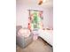Bedroom featuring a bed, chair, and colorful curtains at 2592 King Louis Ne Rd, Conyers, GA 30012