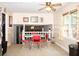 Bright dining area with red chairs, big window, and a view into a living space at 2592 King Louis Ne Rd, Conyers, GA 30012