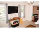 Bright living room with large windows, providing ample natural light and creating a cheerful ambiance at 2592 King Louis Ne Rd, Conyers, GA 30012