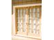 Elegant double patio doors featuring glass panes and classic hardware, seamlessly blending indoor and outdoor spaces at 2592 King Louis Ne Rd, Conyers, GA 30012