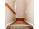 Staircase with wood steps and a handrail at 2592 King Louis Ne Rd, Conyers, GA 30012