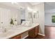 Bathroom features a large mirror and vanity area with double sinks at 4096 Audubon Dr, Marietta, GA 30068