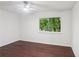 This bright bedroom is enhanced by a large window showcasing the outdoor greenery at 4096 Audubon Dr, Marietta, GA 30068