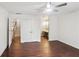 Bedroom with hardwood floors, ceiling fan, closet, and ensuite bathroom at 4096 Audubon Dr, Marietta, GA 30068