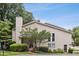 Exterior view of a two-story home with a chimney and well-manicured front yard at 4096 Audubon Dr, Marietta, GA 30068