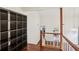 Second floor foyer with a large built in bookcase and hardwood flooring at 4096 Audubon Dr, Marietta, GA 30068