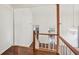 Second floor hallway shows open floor plan to kitchen and living room below at 4096 Audubon Dr, Marietta, GA 30068