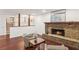 Comfortable living room featuring hardwood floors, a brick fireplace, and natural lighting at 4096 Audubon Dr, Marietta, GA 30068