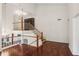 Open-concept living room with hardwood floors, a staircase with wooden railing, and natural lighting at 4096 Audubon Dr, Marietta, GA 30068