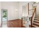 Bright living room boasting high ceilings, hardwood floors, a fireplace, and large windows overlooking the yard at 4096 Audubon Dr, Marietta, GA 30068