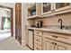 Convenient bar area featuring cabinetry, a mini-fridge, and a countertop with a coffee maker at 4309 Sentinel Post Nw Rd, Atlanta, GA 30327