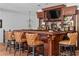 A custom-built bar with a flat-screen TV, bar stools, and ample storage for beverages at 4309 Sentinel Post Nw Rd, Atlanta, GA 30327