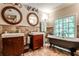 Bathroom with double sinks, elegant mirrors, beautiful tile work, and a luxurious clawfoot tub at 4309 Sentinel Post Nw Rd, Atlanta, GA 30327