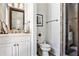 Elegant half bathroom with vanity, mirror, and shower at 4309 Sentinel Post Nw Rd, Atlanta, GA 30327