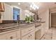 This bathroom features dual sinks with granite countertops, and tile floors at 4309 Sentinel Post Nw Rd, Atlanta, GA 30327