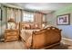 Elegant bedroom featuring classic decor, decorative lamps, carpet floors and comfortable bed at 4309 Sentinel Post Nw Rd, Atlanta, GA 30327