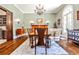 Dining room with a large wooden table, neutral walls and wood floors at 4309 Sentinel Post Nw Rd, Atlanta, GA 30327