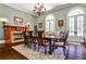 Formal dining room with a fireplace, chandelier, and a table with chairs, and french doors at 4309 Sentinel Post Nw Rd, Atlanta, GA 30327