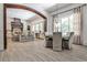 Open concept dining room with chandelier, and bar stool seating at kitchen island at 4309 Sentinel Post Nw Rd, Atlanta, GA 30327