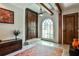 An eye-catching foyer with exposed beams, stone flooring, and a stylish rug at 4309 Sentinel Post Nw Rd, Atlanta, GA 30327