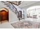 Elegant foyer with staircase and marble floors leading to bright and airy living space at 4309 Sentinel Post Nw Rd, Atlanta, GA 30327