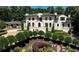 Stunning Mediterranean-style home boasts meticulous landscaping and a grand facade with arched windows at 4309 Sentinel Post Nw Rd, Atlanta, GA 30327