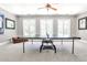 This game room features recessed lighting, a ping pong table, and natural light at 4309 Sentinel Post Nw Rd, Atlanta, GA 30327