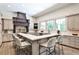 Spacious kitchen featuring an island with seating, custom cabinets, and modern appliances at 4309 Sentinel Post Nw Rd, Atlanta, GA 30327