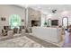 Cozy living room features a stone fireplace, arched windows, and wood floors at 4309 Sentinel Post Nw Rd, Atlanta, GA 30327