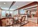 Open-concept living area featuring exposed wood beams and an adjacent kitchen at 4309 Sentinel Post Nw Rd, Atlanta, GA 30327