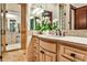 Beautiful bathroom featuring and vanities, granite countertops, and a glass shower at 4309 Sentinel Post Nw Rd, Atlanta, GA 30327