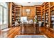 Office with wood paneled walls, custom built-in bookshelves, and a large wooden desk at 4309 Sentinel Post Nw Rd, Atlanta, GA 30327