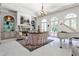 Elegant office space featuring a white baby grand piano, fireplace and built in cabinets at 4309 Sentinel Post Nw Rd, Atlanta, GA 30327