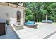 A patio with comfortable seating areas perfect for outdoor relaxation and entertaining in a landscaped backyard at 4309 Sentinel Post Nw Rd, Atlanta, GA 30327