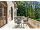 Wonderful balcony patio sitting area with metal table set and stone railing at 4309 Sentinel Post Nw Rd, Atlanta, GA 30327