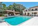An alluring pool area with a covered outdoor kitchen and sunbathing spot in a luxury home at 4309 Sentinel Post Nw Rd, Atlanta, GA 30327