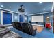 Enjoy the cozy theater room with comfy chairs, a large screen, and a vintage popcorn maker at 4309 Sentinel Post Nw Rd, Atlanta, GA 30327