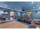 Comfortable theater room featuring leather recliners, projector, and blue carpet at 4309 Sentinel Post Nw Rd, Atlanta, GA 30327