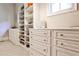 Organized walk-in closet with custom shelving for shoes, drawers, and natural light at 4309 Sentinel Post Nw Rd, Atlanta, GA 30327