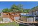 Backyard featuring an elevated wooden deck and a partially covered hot tub at 530 Chicapoo Dr, Marietta, GA 30066