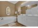 This bathroom features double vanities, a soaking tub, and updated fixtures at 530 Chicapoo Dr, Marietta, GA 30066