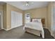 Bedroom featuring carpet floors, a queen-size bed, a ceiling fan, and a spacious closet at 530 Chicapoo Dr, Marietta, GA 30066