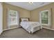 Cozy bedroom features carpeted floors and two large windows bringing in lots of light at 530 Chicapoo Dr, Marietta, GA 30066