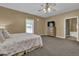 This bedroom features neutral walls and carpeting, and a comfortable queen sized bed at 530 Chicapoo Dr, Marietta, GA 30066