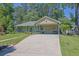 Charming one-story home with a welcoming front porch and a spacious driveway leading to a covered carport at 530 Chicapoo Dr, Marietta, GA 30066