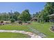 Landscaped front yard with a stone path, flower beds, and mature trees enhancing curb appeal at 530 Chicapoo Dr, Marietta, GA 30066