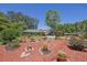 Charming front yard featuring colorful mulch beds, mature trees, and manicured shrubs at 530 Chicapoo Dr, Marietta, GA 30066